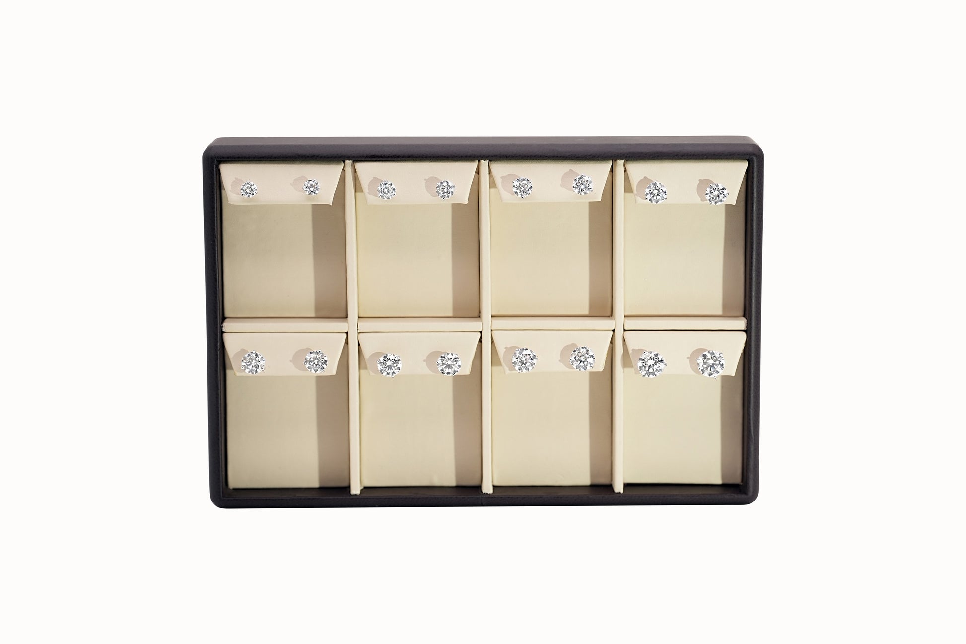 Assortment of diamond stud earrings on a display