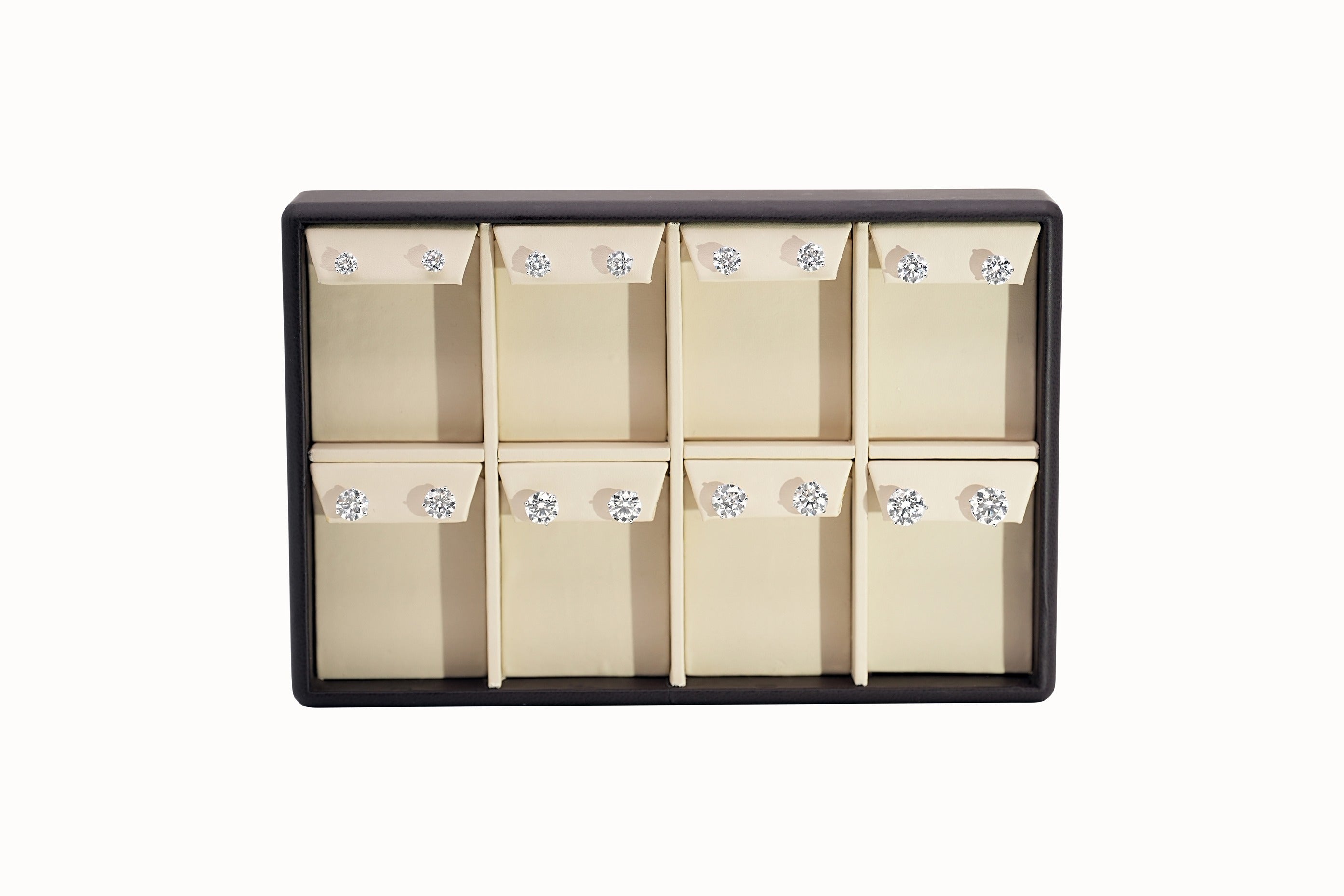 Assortment of diamond stud earrings on a display