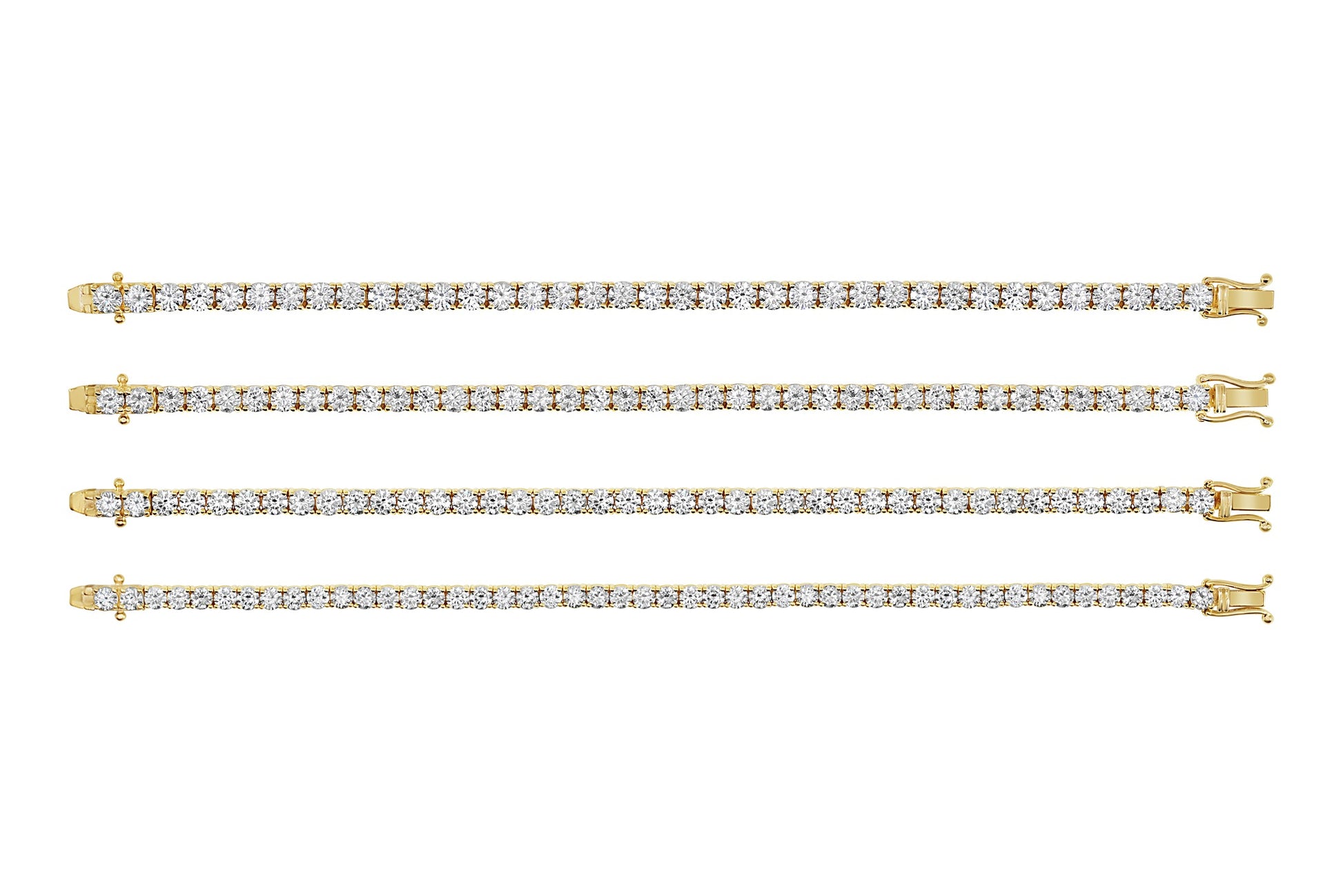 Set of four gold diamond tennis bracelets on a white background