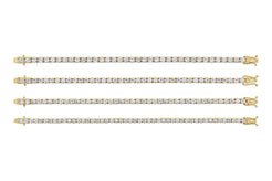 Set of four gold diamond tennis bracelets on a white background