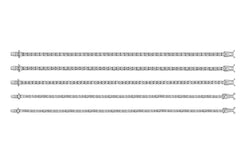 Set of white gold tennis bracelets on a white background