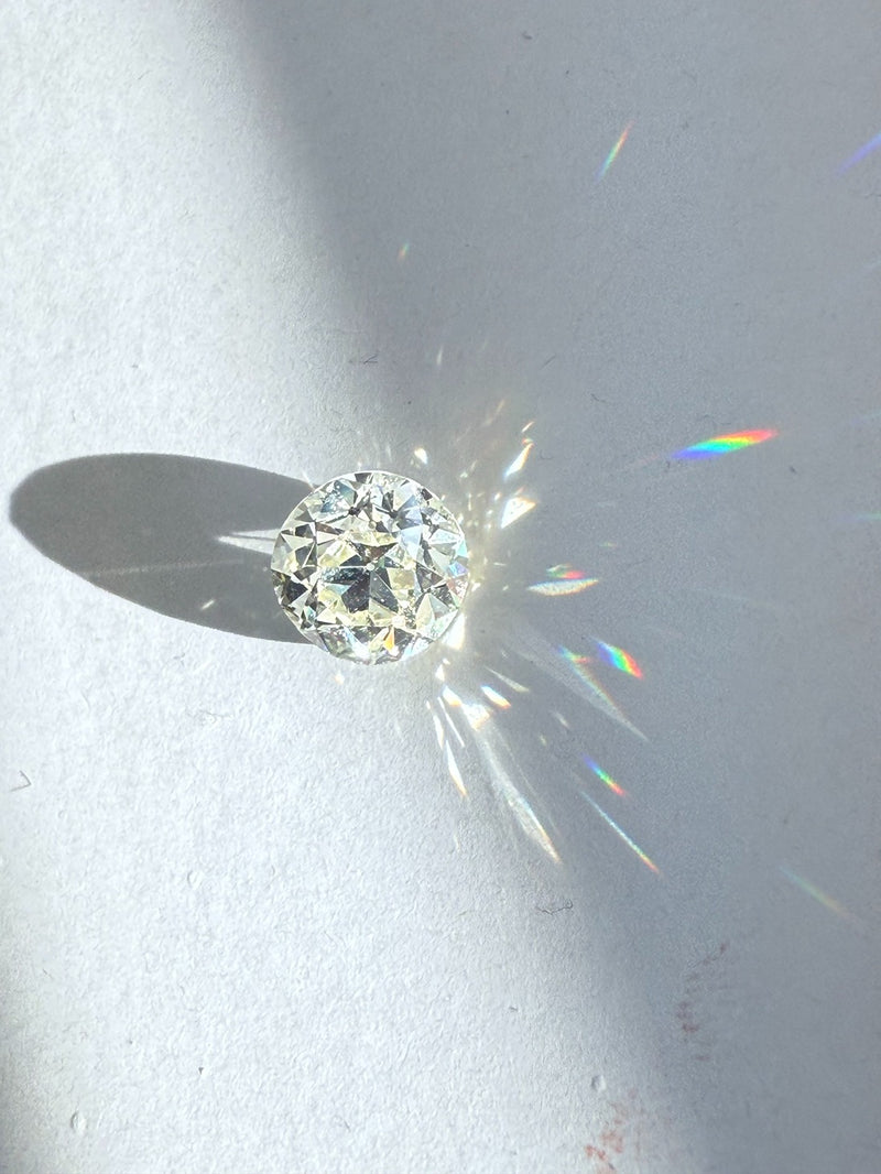 Natural diamond on a light gray background