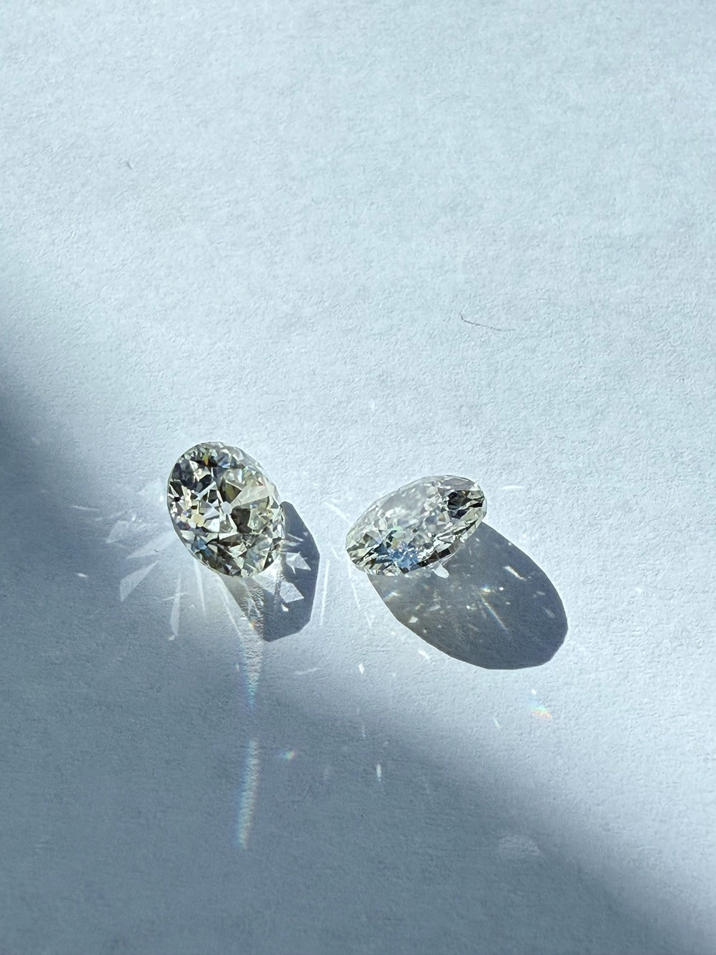 Two diamonds on a white surface
