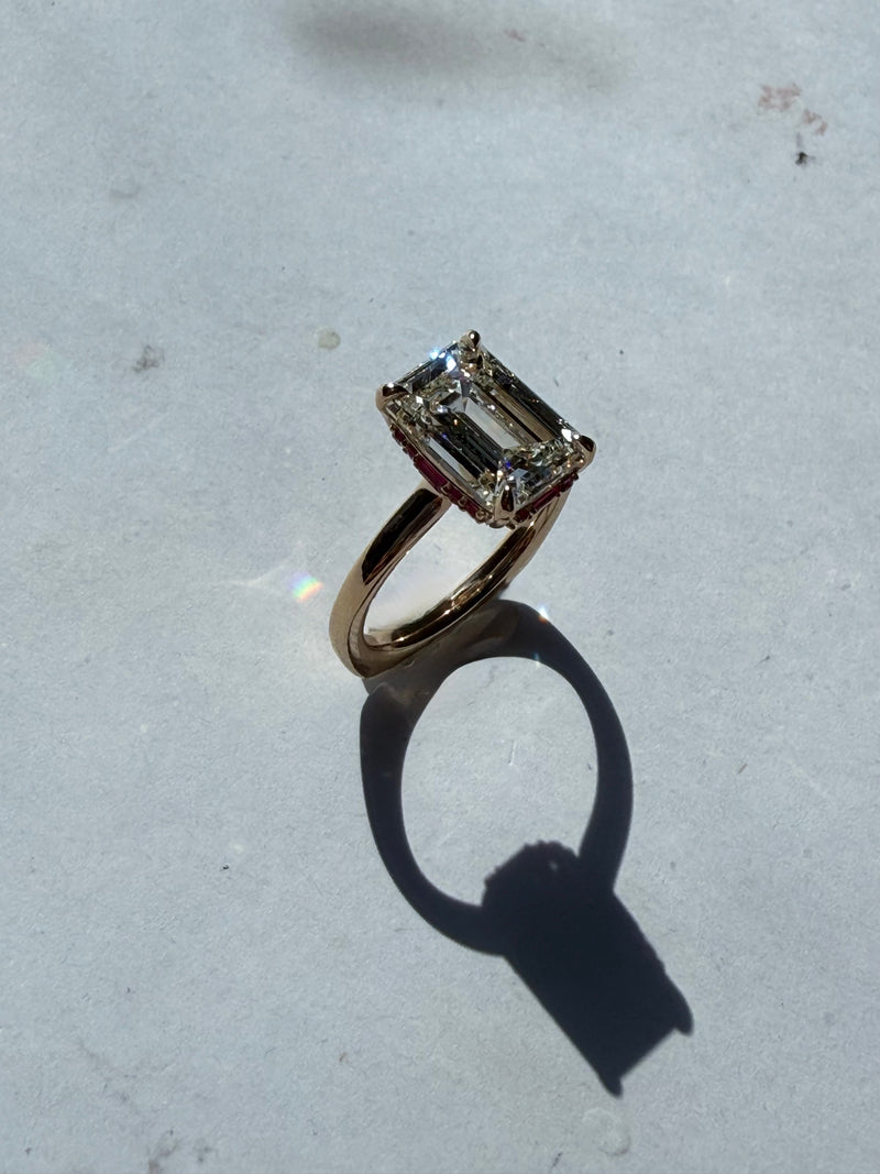 EMERALD DIAMOND ENGAGEMENT RING WITH RUBY HIDDEN HALO
