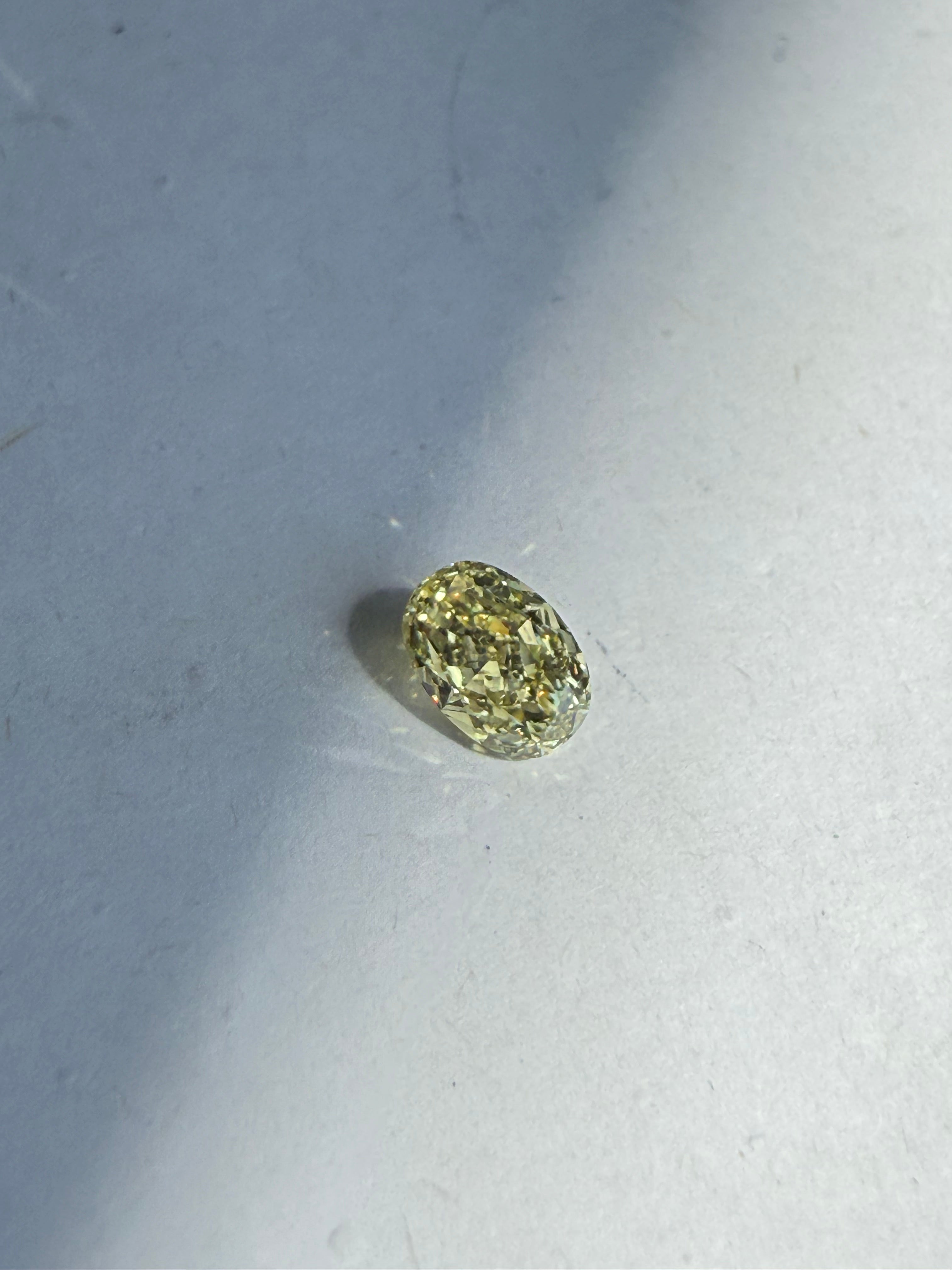 0.70ct fancy yellow oval diamond