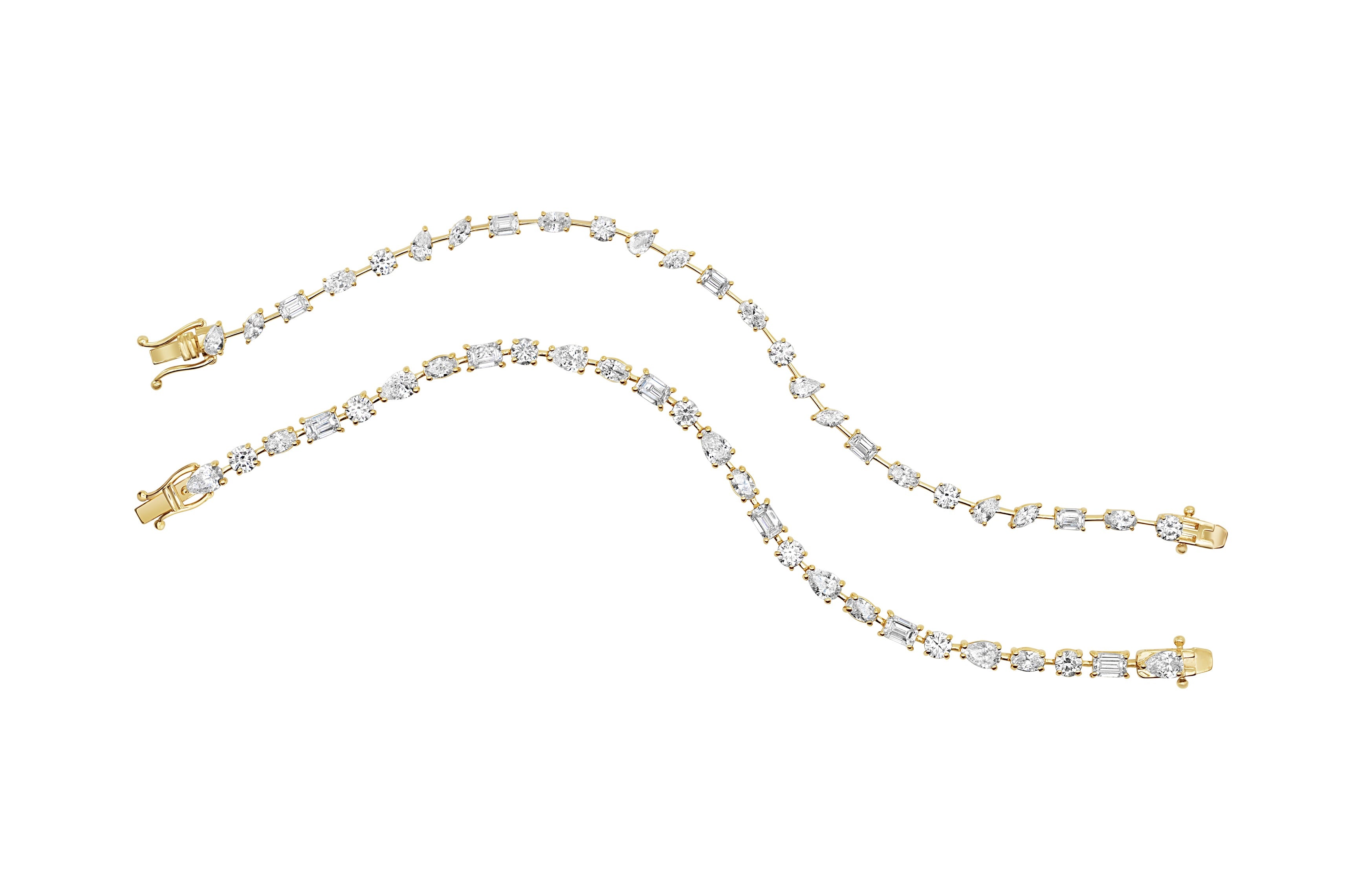 Gold multi shape diamond bracelet on a white background